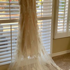 Wedding Dress size 12 never been worn.